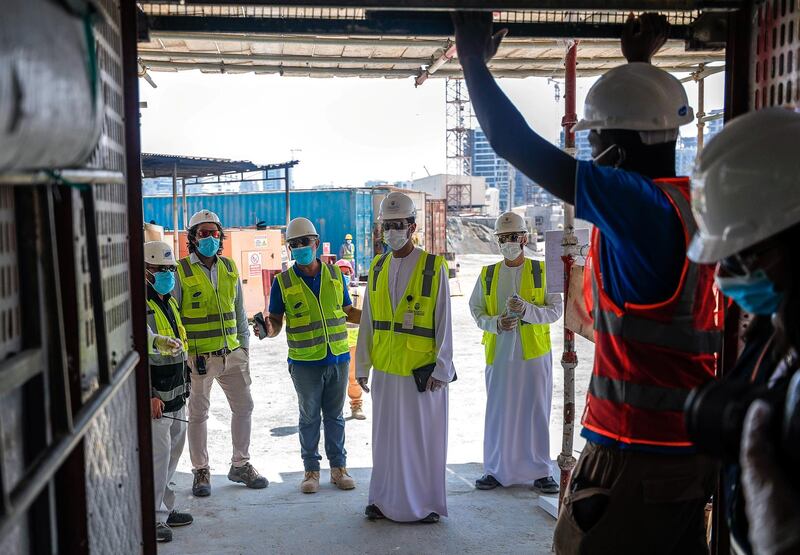 Abu Dhabi, United Arab Emirates, September 27, 2020.  Abu Dhabi City Municipality inspectors check safety standards of a construction site at the Al Raha Gardens, Abu Dhabi.
Victor Besa/The National
Section:  NA
Reporter:  Haneen Dajani