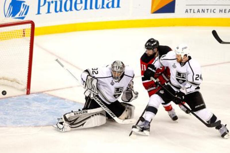 NEWARK, NJ - JUNE 02: Jonathan Quick #32 of the Los Angeles Kings allows a goal from Ryan Carter #20 of the New Jersey Devils (not pictured) as Stephen Gionta #11 and Colin Fraser #24 look on during Game Two of the 2012 NHL Stanley Cup Final at the Prudential Center on June 2, 2012 in Newark, New Jersey.   Paul Bereswill/Getty Images/AFP== FOR NEWSPAPERS, INTERNET, TELCOS & TELEVISION USE ONLY ==

