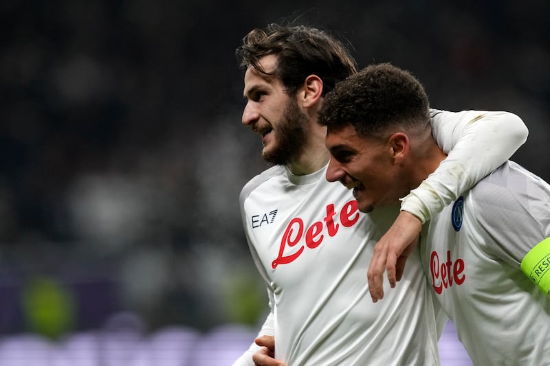 Napoli's Giovanni Di Lorenzo celebrates with Khvicha Kvaratskhelia after scoring his side's second goal in the 2-0 Champions League round of 16 win at Eintracht Frankfurt on February 21, 2023. AP