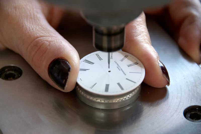 A watchmaker works on the dial of a timepiece. Courtesy Atelier Laurent Ferrier