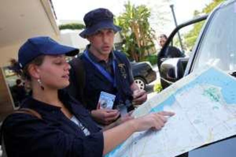 **  CORRECTS NAME OF HOTEL TO MOVENPICK**  Election observers check a map of Beirut before deploying to electoral districts ahead of Sunday parliamentary elections in front of the Movenpick Hotel in Beirut, Lebanon, Tuesday, June 2, 2009. The European Union Election Observation Mission is finalizing preparations to field a total of 100 observers on election day. (AP Photo/Bilal Hussein) *** Local Caption ***  BEI101_CORRECTION_Mideast_Lebanon_EU_Election_ObserversHURV.jpg