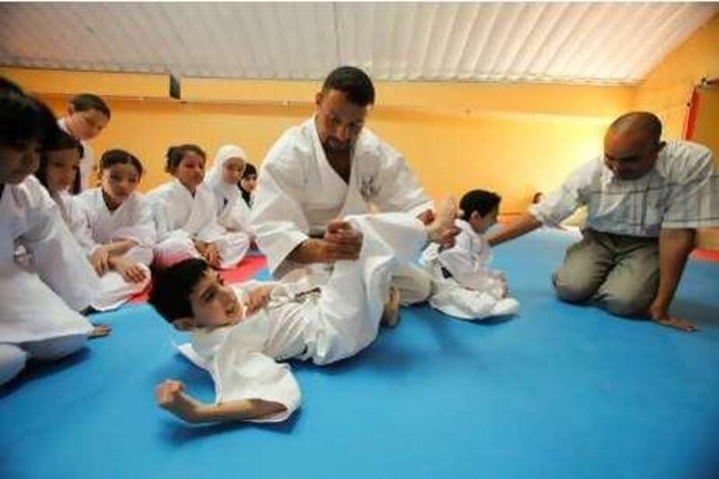 Karate coach Hosam Ayyad trains Karate to children suffering from various physical and mental challenges at a club in Amman, Jordan on July 08, 2010. (Salah Malkawi for The National)