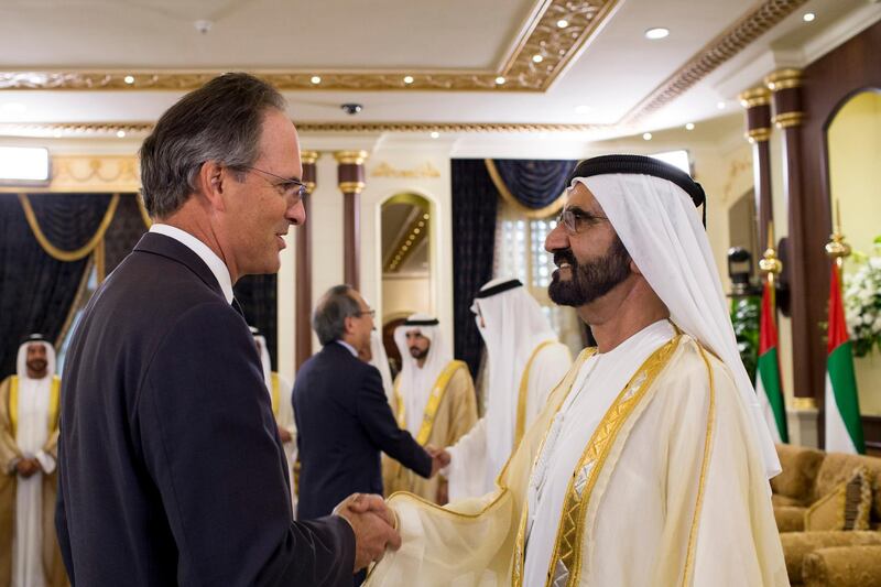 ABU DHABI, UNITED ARAB EMIRATES - September 24, 2015: HH Sheikh Mohamed bin Rashid Al Maktoum, Vice-President, Prime Minister of the UAE and Ruler of Dubai (R), greets HE Philip Parham, Ambassador of the UK to the UAE (L), during an Eid Al Adha reception at Mushrif Palace.  
( Ryan Carter / Crown Prince Court - Abu Dhabi ) *** Local Caption ***  20150924RC_C115324.jpg