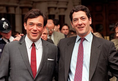 Kevin Maxwell (R) celebrates outside the High Court, London, in 2001 after a judge ruled he should not stand trial for a second time on charges relating to the collapse of his father's media empire. PA Images via Getty