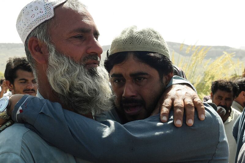 Relatives mourn during the funeral of a quake victim the mountainous district of Harnai in south-west Pakistan. AFP