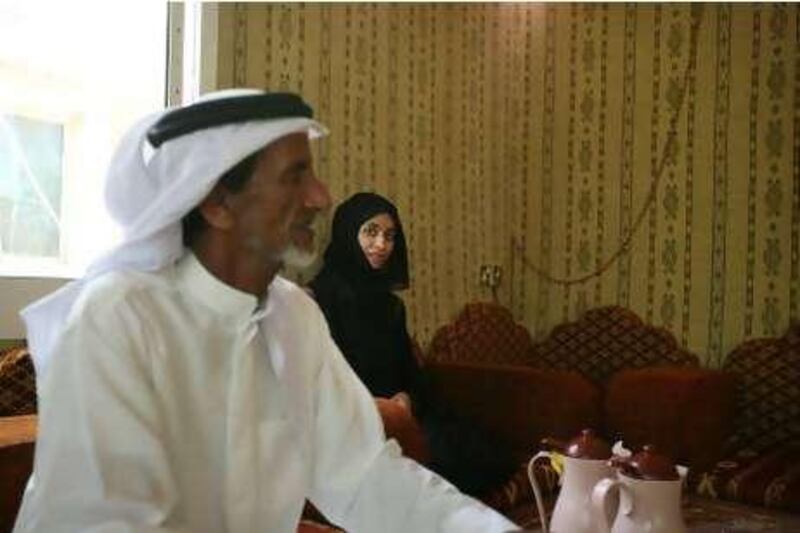 United Arab Emirates - Delma Island - July 27, 2010.

NATIONAL: Fisherman Juma al Qubaisi (cq-al) discusses the history of Delma Island, pearl diving, the influence of Sheikh Zayed and his hopes for his daughter Ayesha al Qubaisi (cq-al), 30, right, at his home on Tuesday, July 27, 2010. Ayesha is a work placement officer at the Desert Islands Education Centre. Amy Leang/The National