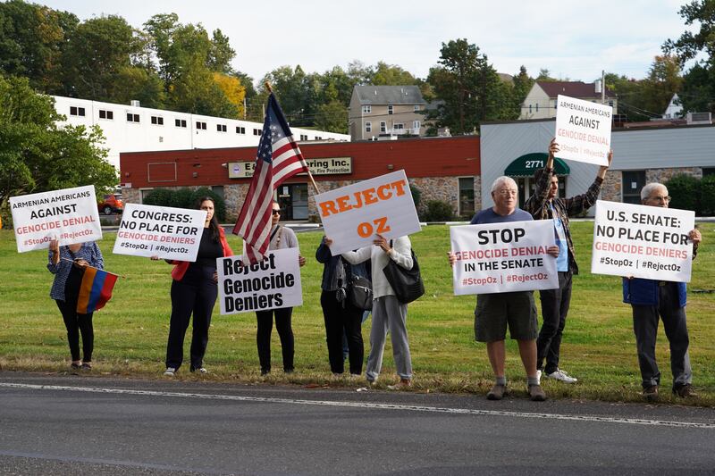 Protesters line the street.