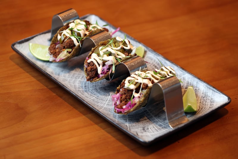 The tacos are made from a shell of courgette, with lentil walnut meat, lettuce, avocado, chipotle aioli and jalapenos