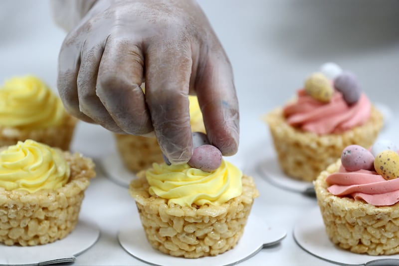 SugarMoo head chef Ajandha decorates nests of Rice Krispies with chocolate eggs. The cream topping is flavoured with either rose or mango.