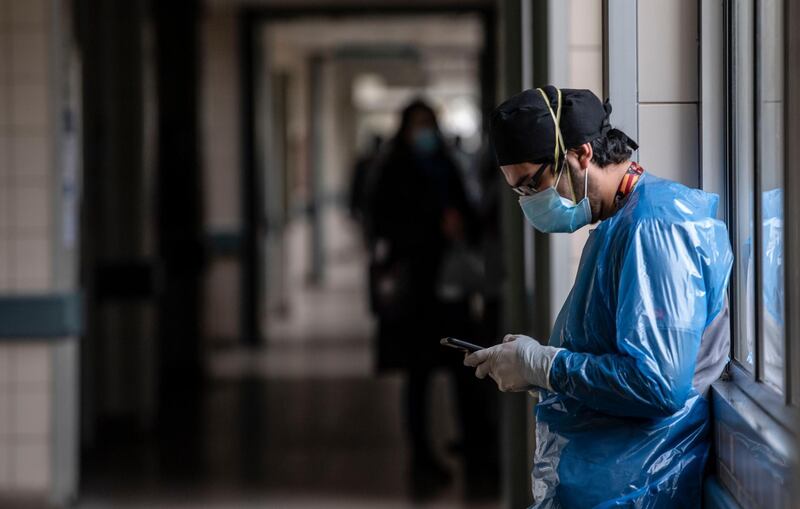 A nurse from the Critical Patients Unit takes a break at Barros Luco Hospital, in Santiago, Chile. AFP