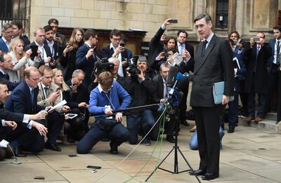 epa07167419 Conservative MP Jacob Rees-Mogg (R) gives a statement to the press outside the Palace of Westminster in London, Britain, 15 November 2018. According to reports, Mogg will send a letter of no confidence in Prime Minister Theresa May. British Prime Minister Theresa May is facing pressure in Parliament after six ministers had resigned earlier in the day over her Brexit deal.  EPA/FACUNDO ARRIZABALAGA