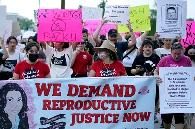 Protesters march around the Arizona Capitol after the Supreme Court decision to overturn the Roe v. Wade, on June 24, 2022, in Phoenix. AP