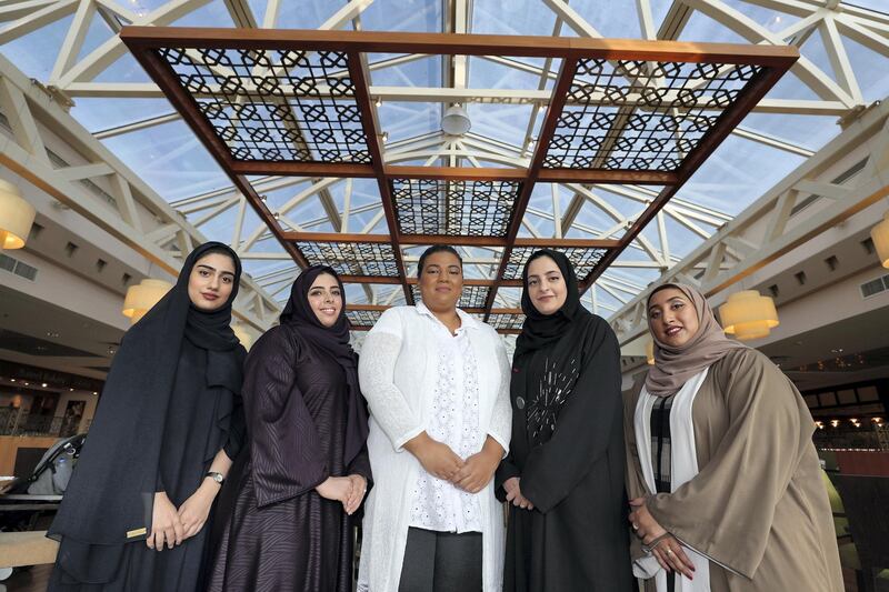 Dubai, United Arab Emirates - July 25, 2018: L-R Shamma Al Bastaki, Shahd Thani, Afra Atiq, Fatma Al Bannai, Hessa Al Banafsaj. Community story for summer series focuses on Untitled Chapters, a community of Emirati women encouraging each other to publish their stories and written work. Wednesday, July 25th, 2018 in Town Centre, Jumeirah, Dubai. Chris Whiteoak / The National