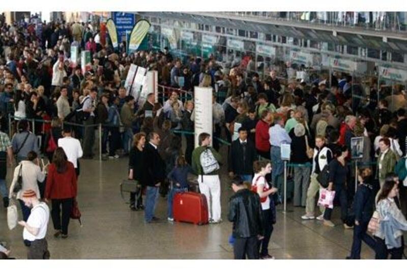 Passengers line up to buy train tickets at Rome's Termini station as flights remain grounded in large parts of the continent.