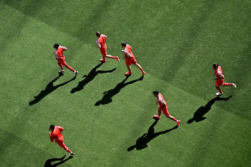 An aerial view of Switzerland players warming up ahead of the game. AFP
