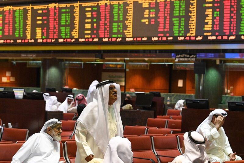 epa07731132 Kuwaiti traders sit and observe the stock market's developments at the trading hall of the Kuwait Stock Exchange, in Kuwait City, Kuwait, 21 July 2019. The Premier Market Index of the national stock market of Kuwait, Boursa Kuwait, dropped on 21 July by 1.22 per cent.  EPA/NOUFAL IBRAHIM