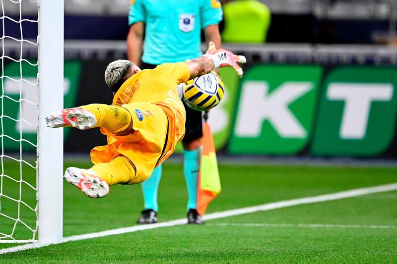 Keylor Navas stops Lyon' sixth penalty. AFP