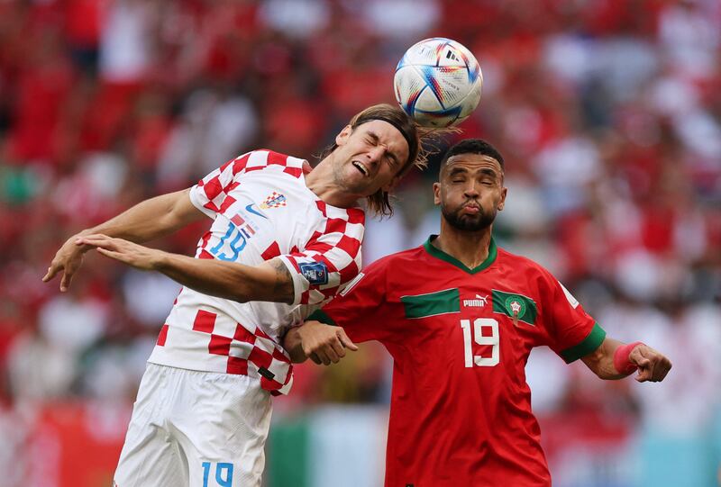 Croatia's Borna Sosa fights for the ball with Morocco's Youssef En-Nesyri. Reuters
