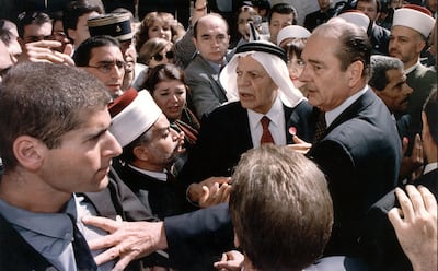 French President Jacques Chirac pushes an Israeli security official as he protests against the tight security surrounding his visit to the Arab part of Jerusalem's Old City in October 1996. AFP