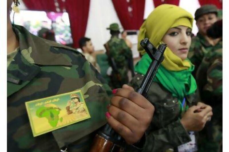 Female volunteer government fighters attend a women's forum in Tripoli. Reuters