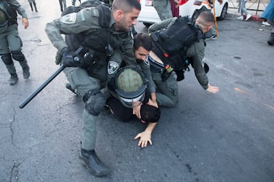 Israeli police officers clash with Palestinians during the annual Israeli flag march near Dung Gate on May 29, 2022 in Jerusalem. Getty