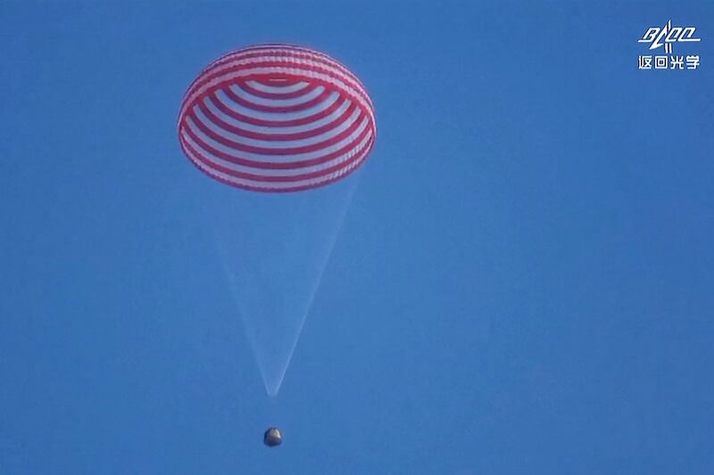 The capsule of the Shenzhou-13 spacecraft prepares to land in Inner Mongolia, China. AFP