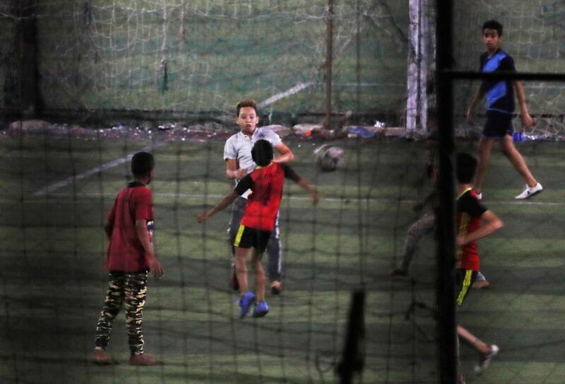 Youth play football at a local sport centre after months of lockdown in Cairo. Reuters
