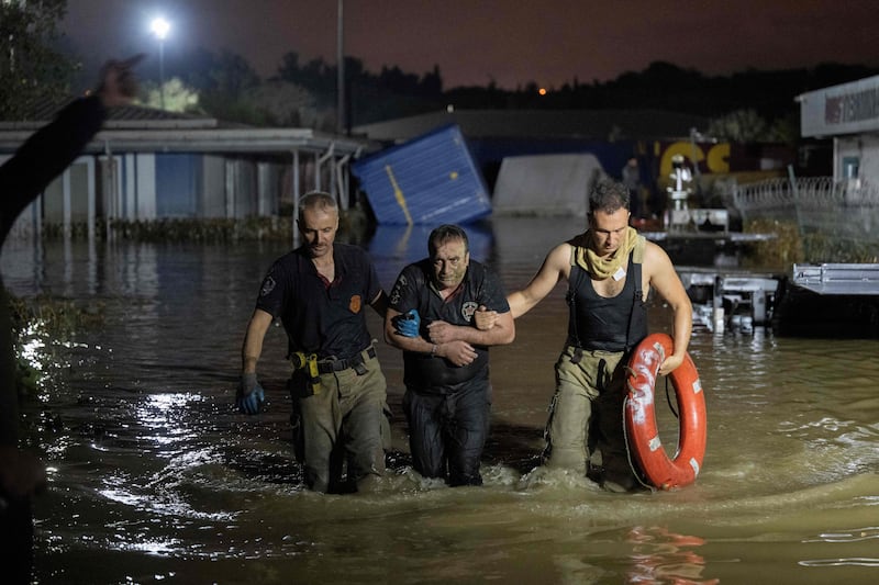 A man is rescued and evacuated during flooding of Kucukcekmece district in Istanbul on September 5, 2023. AFP