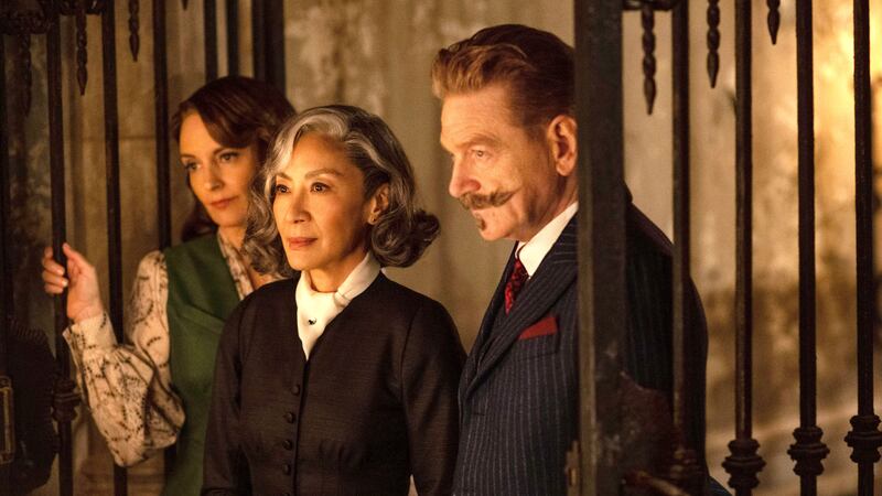From left, Tina Fey, Michelle Yeoh and Sir Kenneth Branagh in A Haunting in Venice. Photo: Disney