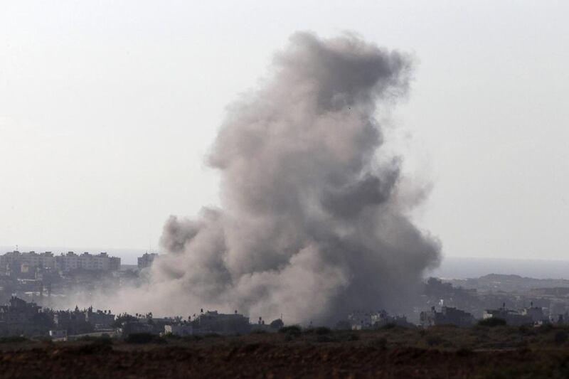 Smoke rises after an explosion in Gaza on August 2, 2014. Some Israeli ground forces withdrew from the Gaza Strip on Saturday, after the military said it was close to achieving its main war goal of destroying Hamas cross-border tunnels. Siegfried Modola / Reuters