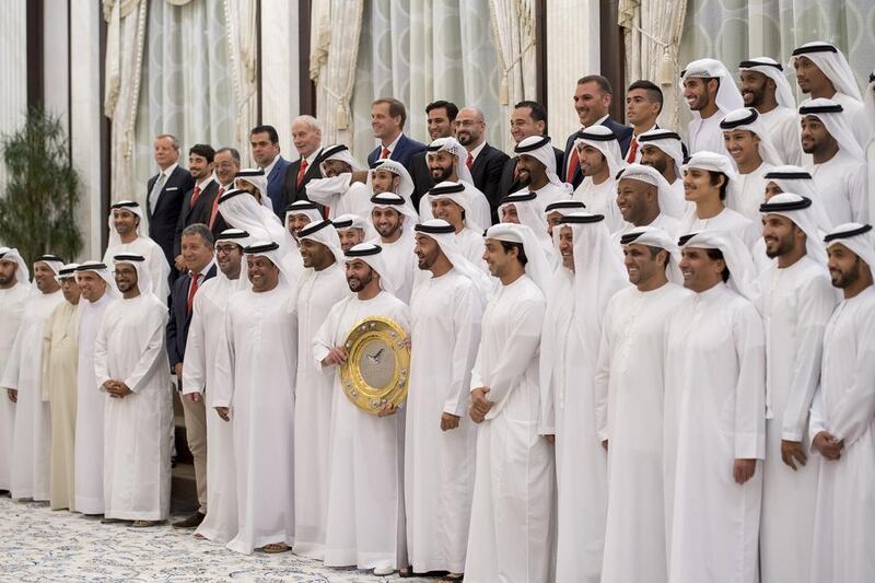 Sheikh Mohammed bin Zayed, Crown Prince of Abu Dhabi and Deputy Supreme Commander of the Armed Forces, stands for a photograph with Al Jazira Football Club during an iftar reception at Al Bateen Palace. Seen with Sheikh Mansour bin Zayed, Deputy Prime Minister and Minister of Presidential Affairs, Sheikh Hamdan bin Zayed, Ruler’s Representative in the Western Region of Abu Dhabi, Sheikh Mohammed bin Hamdan (11th R) and Mohammed Al Romaithi, Chairman of Thani Murshed Establishment (10th R). Rashed Al Mansoori / Crown Prince Court — Abu Dhabi