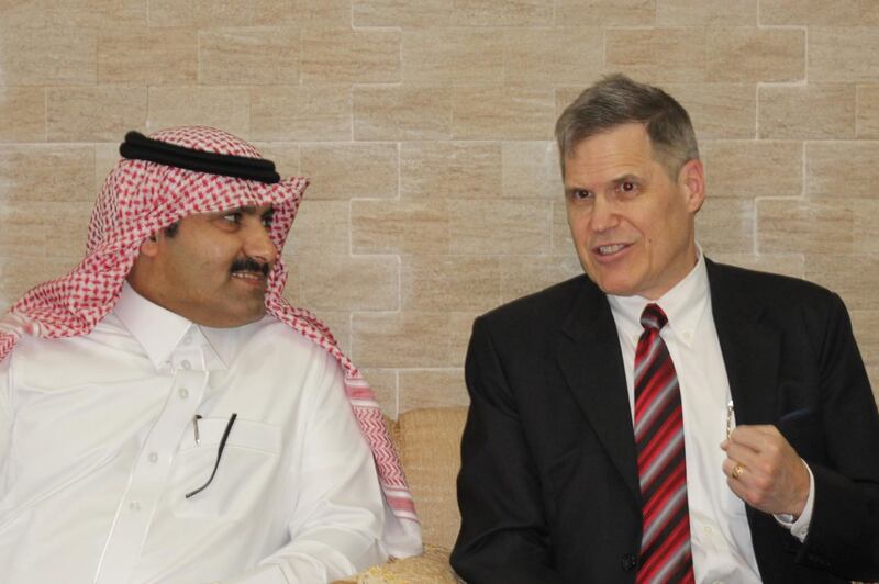 Saudi Ambassador to Yemen Mohammed Bin Saeed Al-Jaber, left, and his US counterpart Matthew H Tueller speak as they arrive at Mukalla airport, in Yemen.  AFP