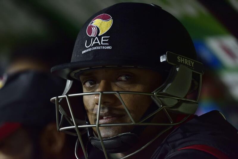 UAE's batsman Amjad Javed waits his turn to bat as he sits on the UAE bench during a Pool B Cricket World Cup match between South Africa and UAE (United Arab Emirates) at Wellington Regional Stadium in Wellington on March 12, 2015. AFP PHOTO / MARTY MELVILLE