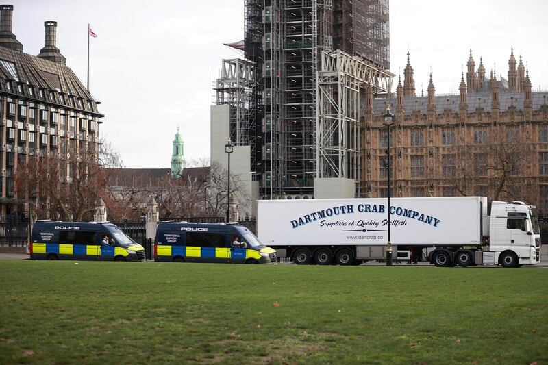 A lorry drives through Parliament Square in London. Reuters