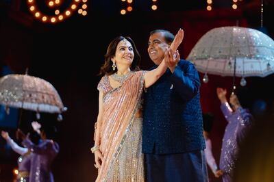 Indian billionaire Mukesh Ambani and his wife Nita Ambani perform on stage in Jamnagar. Photo: Manish Malhotra
