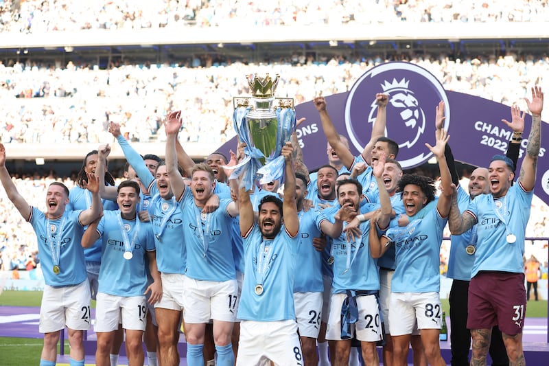 Manchester City's Ilkay Guendogan lifts the Premier League trophy following the game against Chelsea at the Etihad Stadium on May 21, 2023. Getty
