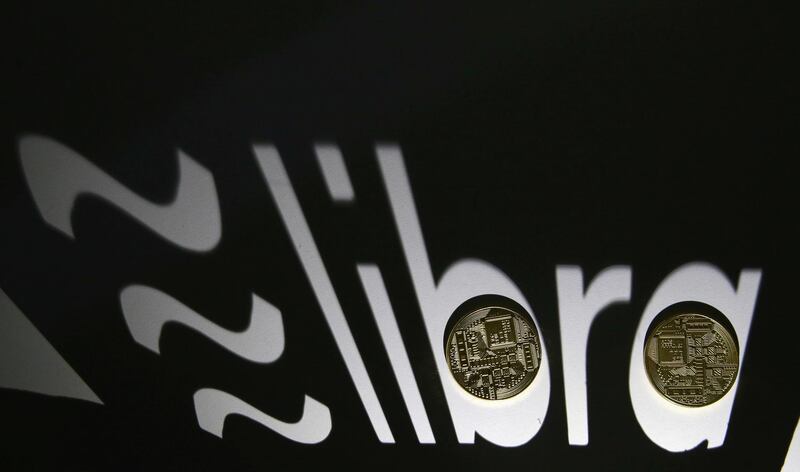 FILE PHOTO: FILE PHOTO: Shadow of a 3D-printed Facebook Libra cryptocurrency logo is seen near cryptocurrency representation in this illustration taken, September 13, 2019. REUTERS/Dado Ruvic/File Photo/File Photo