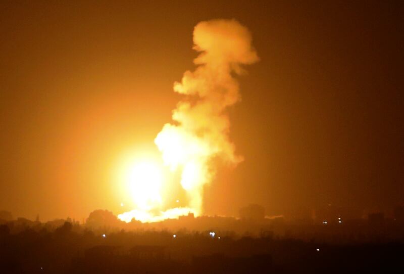 A fireball rises following an air strike in Khan Yunis in the southern Gaza Strip. Said Khatib / AFP