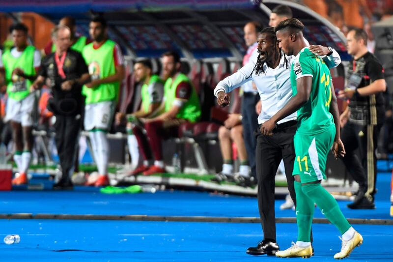 Cisse  speaks with Senegal's forward Keita Balde during the final. AFP