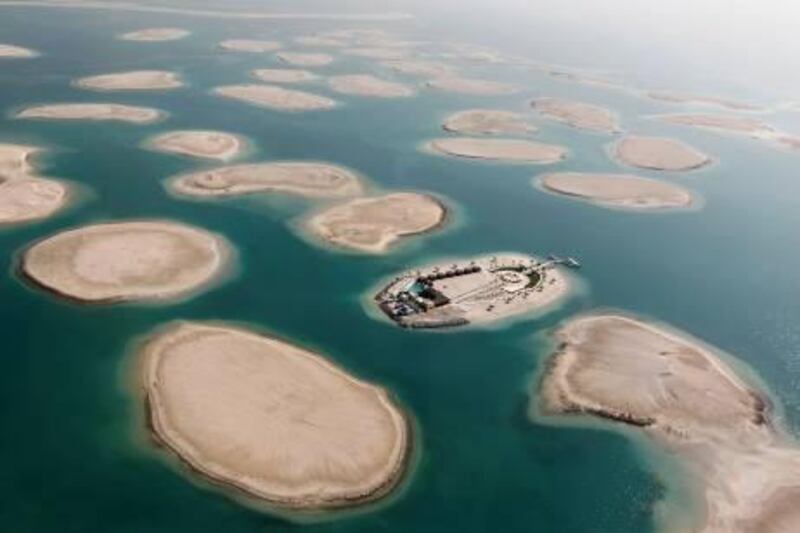 A development is seen on one of the islands of The World Islands project in Dubai January 7, 2012. The World Islands is located approximately 4 km (2.5 miles) off the coast of Jumeirah. The collection of man-made islands are shaped into the continents of the world, and will consist of 300 small private artificial islands divided into four categories - private homes, estate homes, dream resorts, and community islands, according to the development company Nakheel Properties Group. REUTERS/Jumana El Heloueh (UNITED ARAB EMIRATES - Tags: CITYSPACE REAL ESTATE BUSINESS SOCIETY WEALTH) *** Local Caption ***  DUB05_EMIRATES-_0107_11.JPG