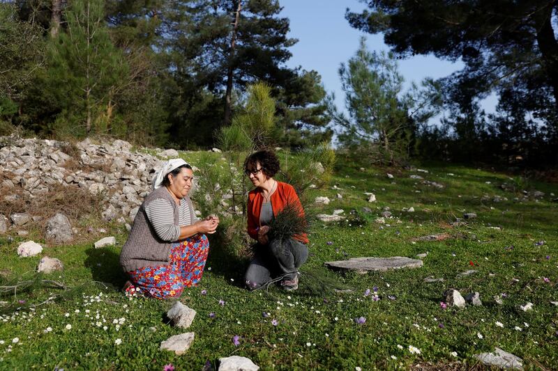 Environmental consultant Deniz Gumusel talks with Aytac Yakar, from Ikizkoy village, near Milas, in Mugla province, Turkey. Ms Gumusel claims pollution from coal power plants in the region has caused the death of 45,000 people in 40 years. Reuters