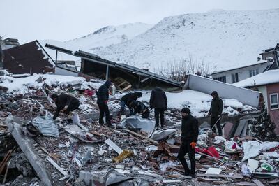 Emergency workers search the site of a collapsed building in Kahramanmaras, Turkey. EPA