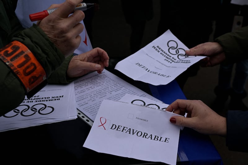 Police officers vote on leaflets, in Rennes, western France, in favour of compensation for working at the Olympics. AFP