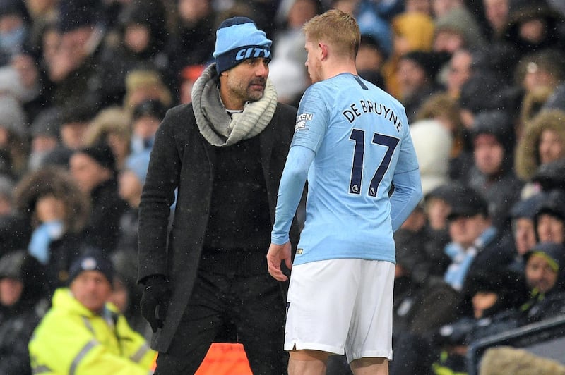 Manchester City's Spanish manager Pep Guardiola gives instructions to Manchester City's Belgian midfielder Kevin De Bruyne during the English Premier League football match between Manchester City and Everton at the Etihad Stadium in Manchester, north west England, on December 15, 2018. (Photo by Oli SCARFF / AFP) / RESTRICTED TO EDITORIAL USE. No use with unauthorized audio, video, data, fixture lists, club/league logos or 'live' services. Online in-match use limited to 120 images. An additional 40 images may be used in extra time. No video emulation. Social media in-match use limited to 120 images. An additional 40 images may be used in extra time. No use in betting publications, games or single club/league/player publications. / 