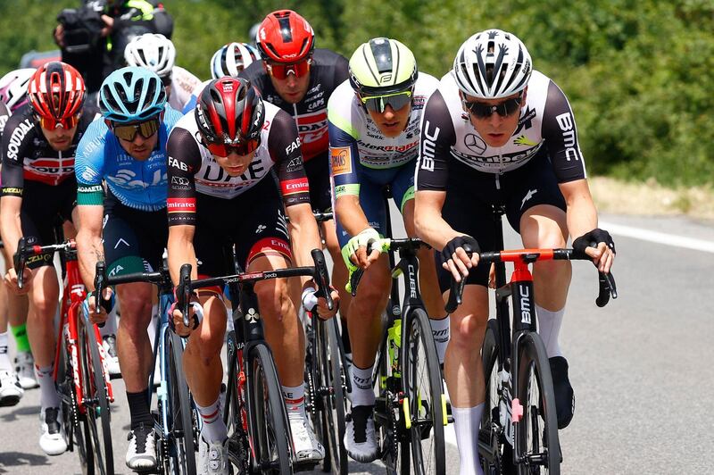 Team UAE Emirates rider Italy's Alessandro Covi (L) and Team Qhubeka Assos rider Switzerland's Mauro Schmid (R) ride during the eleventh stage of the Giro d'Italia 2021 cycling race, 162 km between Perugia and Montalcino on May 19, 2021.   / AFP / Luca BETTINI

