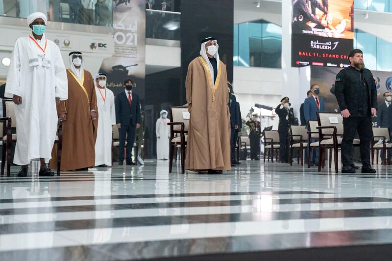 ABU DHABI, UNITED ARAB EMIRATES - February 21, 2021: HH Sheikh Mansour bin Zayed Al Nahyan, UAE Deputy Prime Minister and Minister of Presidential Affairs (C), stands during the UAE national anthem, during the opening ceremony of the 2021 International Defence Exhibition and Conference (IDEX), at Abu Dhabi National Exhibition Centre (ADNEC). Seen with HE Ramzan Kadyrov President of the Chechnya (R).

( Mohamed Al Hammadi / Ministry of Presidential Affairs )​
---