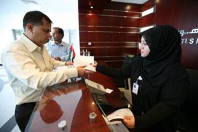 People obtain their ID cards at the Emirates Identity Authority registration centre in Al Barsha in Dubai.