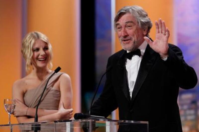 Jury President Robert de Niro (R) and Master of Ceremony Melanie Laurent stand on stage during the closing ceremony of the 64th Cannes Film Festival May 22, 2011.          REUTERS/Yves Herman (FRANCE  - Tags: ENTERTAINMENT) *** Local Caption ***  CAN231_FILM-CANNES-_0522_11.JPG