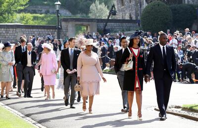 WINDSOR, UNITED KINGDOM - MAY 19: Idris Elba and Sabrina Dhowre followed by Oprah Winfrey (fourth right) arrive at St George's Chapel at Windsor Castle for the wedding of Meghan Markle  and Prince Harry on May 19, 2018 in Windsor, England. (Photo by Chris Radburn - WPA Pool/Getty Images)