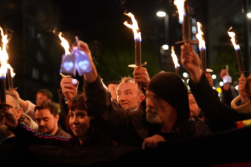 People attend a candlelit procession and vigil in the northern city Manchester to remember all those who have died due to the pandemic. Getty Images
